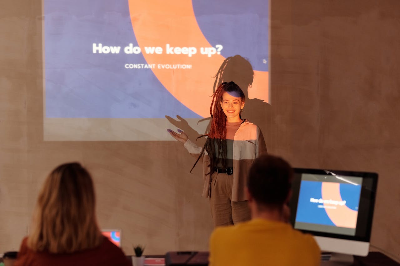 Crafting Captivating Headlines: Your awesome post title goes here Business meeting featuring a presenter with a projected slide and engaged audience.
